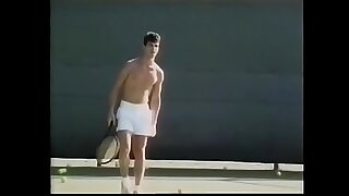Tennis player likes to loosen his penis pretentious huskiness after excercises with ball shooter appliance increased by drop his load on his tennis racket